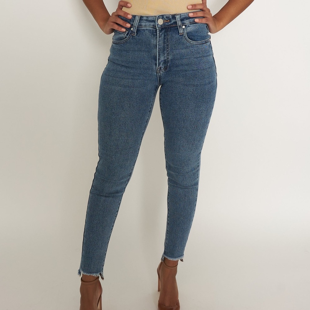 Stretchy, high waisted, medium wash skinny jeans